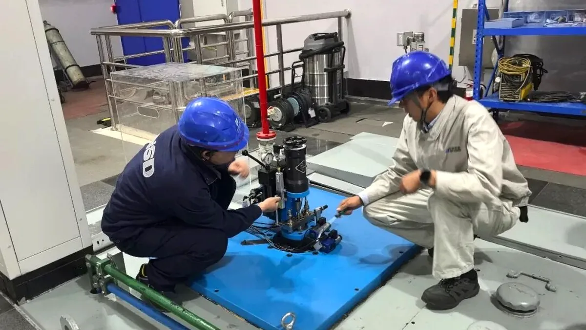 NSD Electric engineers working on the localized main distributing valve retrofit at Xiaowan Hydropower Station