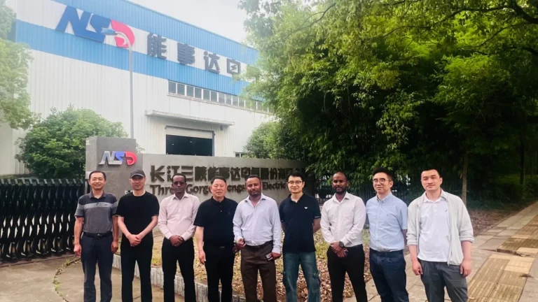 Ethiopian power company delegation posing with the NSD Electric team outside the company's headquarters in China.