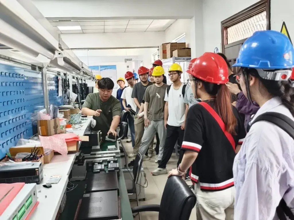 Students visit NSD Electric’s electrical equipment assembly area during the 2026 industrial internship program.